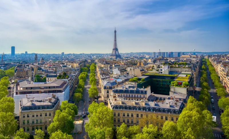 a view of the eiffel tower and paris, france from the arc de triomphe