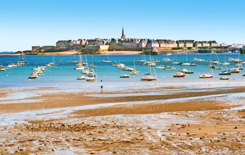 at low tide in the estuary of rance in côtes-d'armor, pleasure boats or fishing rest on their keel