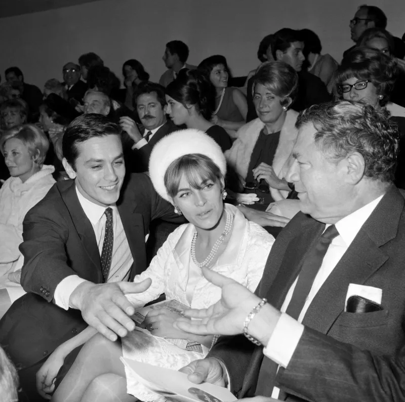 undated photo shows french actor alain delon (l) and his wife nathalie at a parisian concert hall (photo by -   upi   afp)
