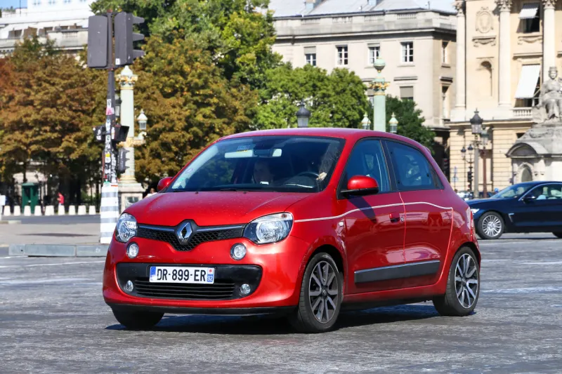 paris, france - september 15, 2019  red compact car renault twingo in the city street