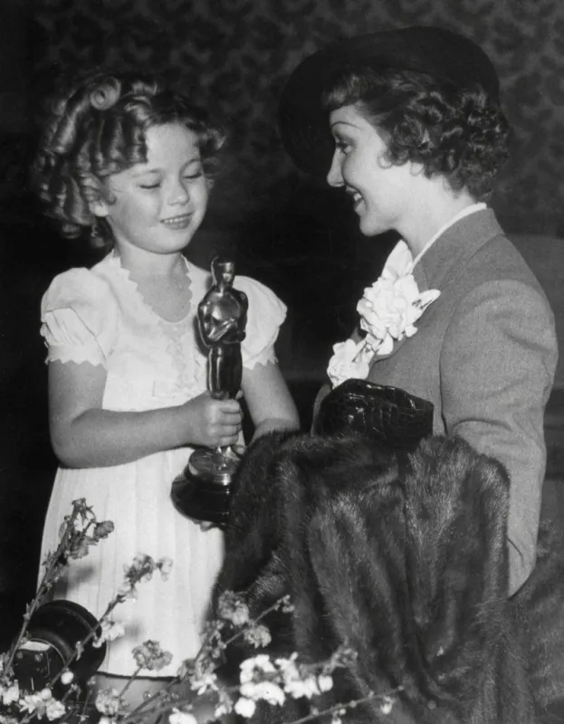 at the academy awards in 1935, shirley temple presented the best actress oscar to french-born actress claudette colbert for her role in, it happened one night photo by joemartinez netropolispicturelux   avalon abacapresscom