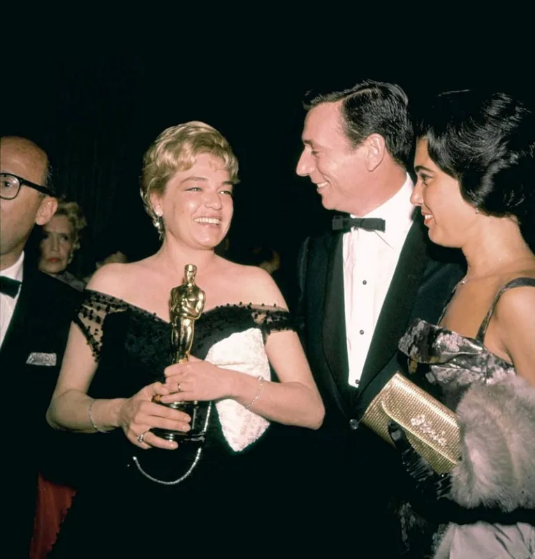 french actress simone signoret, sammy cahn and yves montand attend to the 32nd annual academy awards in los angeles, ca in april 4, 1960 photo by david sutton lfi abacapresscom