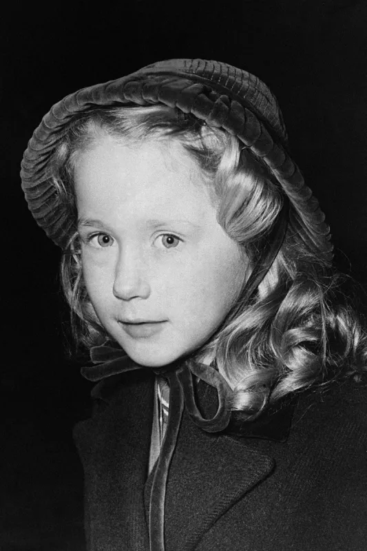 french actress brigitte fossey, six years old, is pictured in london on february 10, 1953 she came to present a bouquet to the queen (not pictured) at the rialto cinema where a french film festival opens afp photo (photo by afp)
