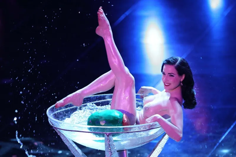 dita von teese performs on the stage of the ariston theatre in san remo, italy, during the 60th italian music festival on february 16, 2010 photo by olycom abacapresscom