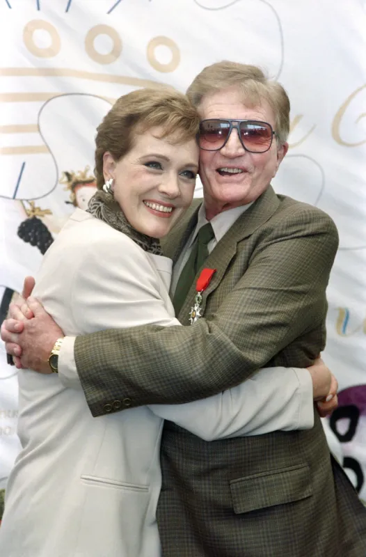 us director blake edwards poses with his wife julie andrews, after receiving the legion of honor, on may 09, 1992 during the international cannes film festival (photo by michel gangne   afp)
