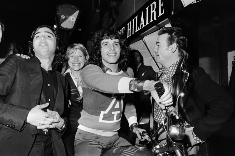 picture taken on april 11, 1973 at paris showing french singer julien clerc (c) on a motorcycle during the event la nuit de la moto (photo by georges bendrihem   afp)