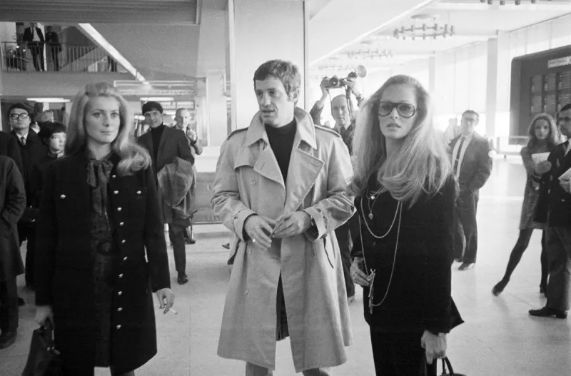 a photo taken on november 29, 1968 shows french actors catherine deneuve (l), jean-paul belmondo and his companion swiss actress ursula andress at orly airport afp photo (photo by upi   afp)   france only