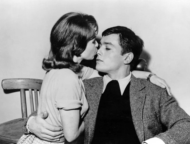 photo taken in april 1959 at billancourt studios shows french actress françoise arnoul (l) kissing actor alain delon during the filming of way of youth directed by michel boisrond (photo by afp)