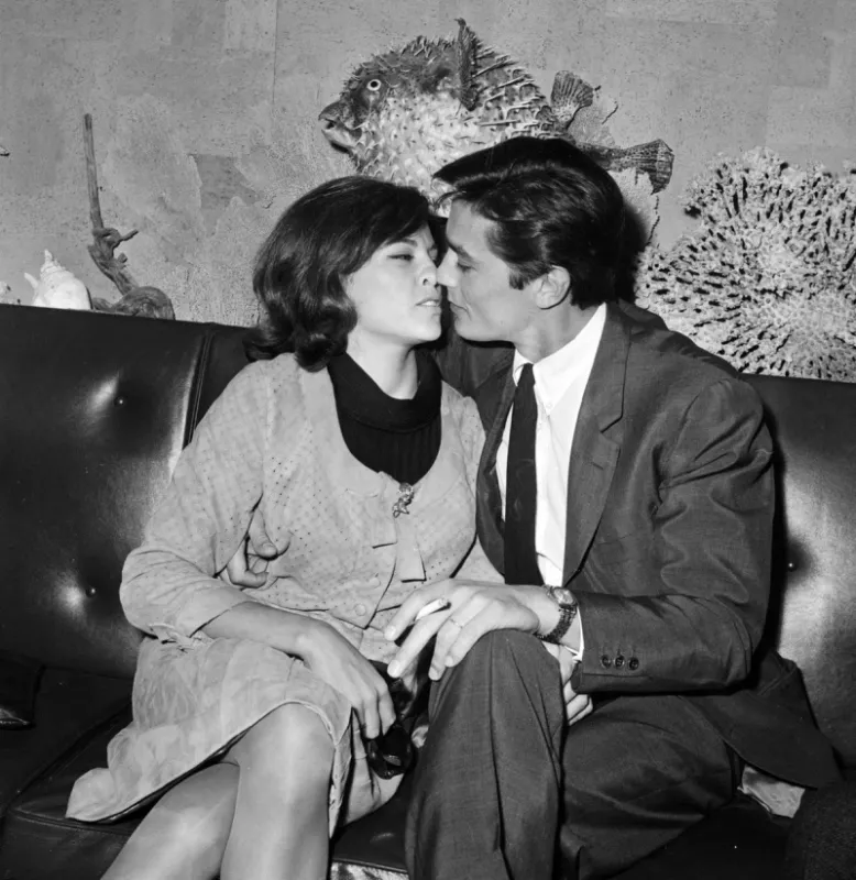 french actor alain delon shown in a photo dated 28 april 1965 kissing his wife nathalie on his arrival at orly airport (photo by afp)