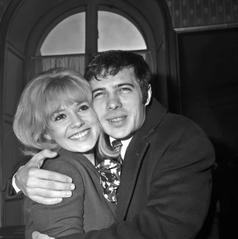 french humorist and actor guy bedos hugs his wife, actress sophie daumier, during their wedding on february 19, 1956 in paris (photo by afp)