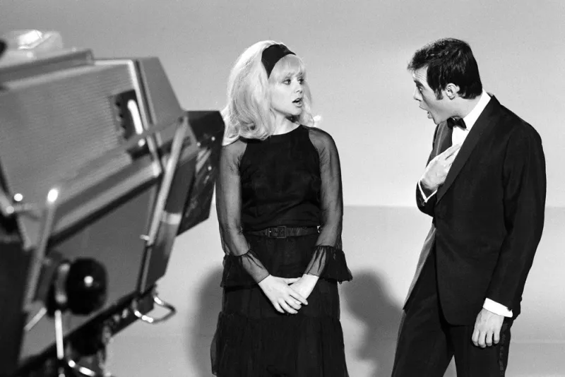 french actor and humorist guy bedos and his wife sophie daumier rehearse a scene for the tv show tete-beche, on january 15, 1966, in paris (photo by afp)