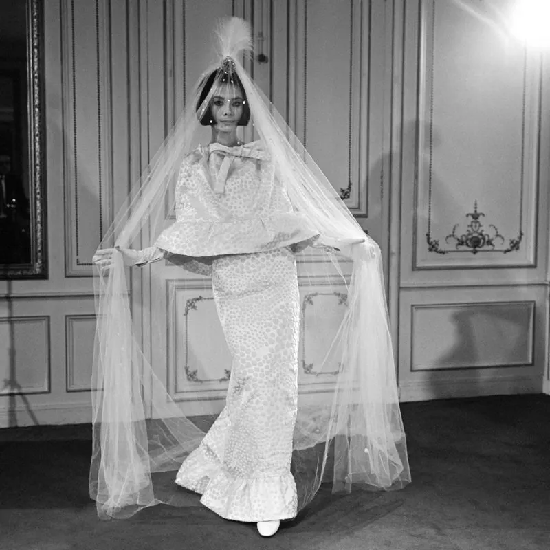 picture taken on august 21, 1964 at paris showing a fashion model with a wedding dress created by french fashion designer pierre cardin as part of his autumn-winter 1964-1965 collection (photo by afp)