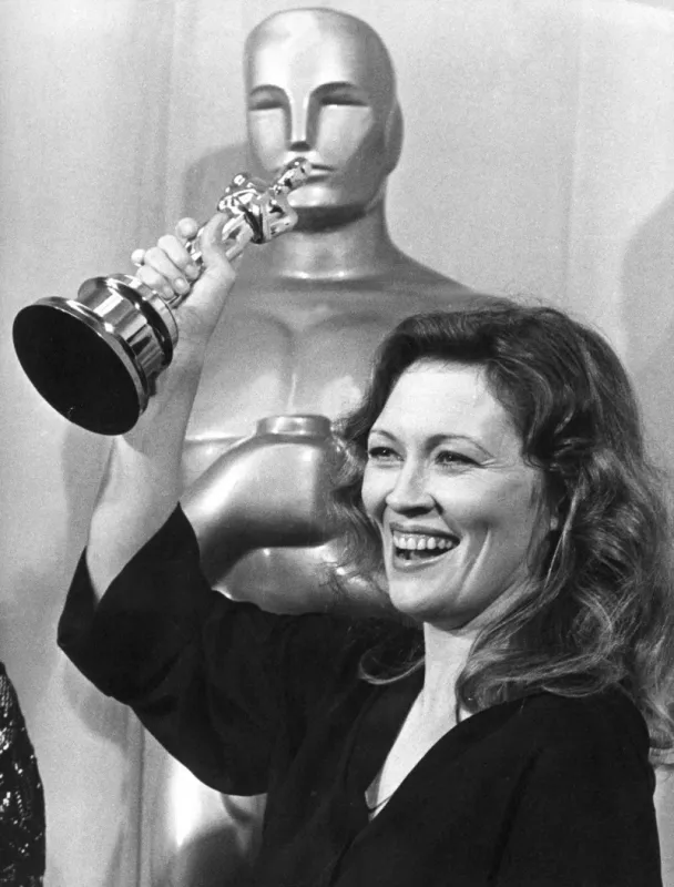 actress faye dunaway holds the oscar high over her head in exitement on april 7, 1977, at the 49th annual academy awards at the music center miss dunaway won her oscar for her role in the film network (photo by pigiste   unipix   afp)