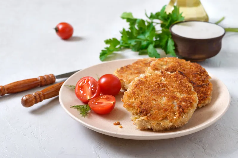 vegetarian pancakes with cabbage on a plate with sour cream diet menu