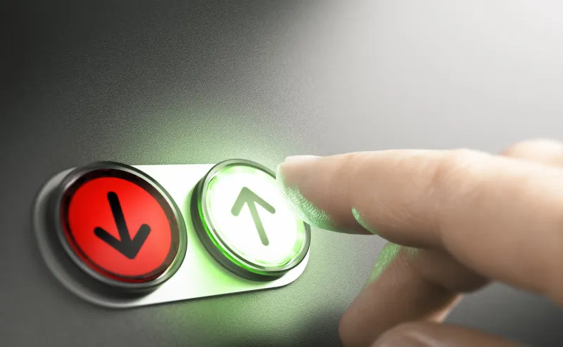 man pressing a green button with an arrow on a simple board composite image between a hand photography and a 3d background