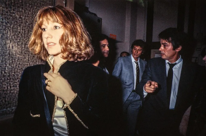 french actress nathalie baye, followed by jean-claude brialy (2ndl), johnny hallyday (c) and alain delon (r), leaves the theatre edouard vii, on february 14, 1984, in paris (photo by afp)