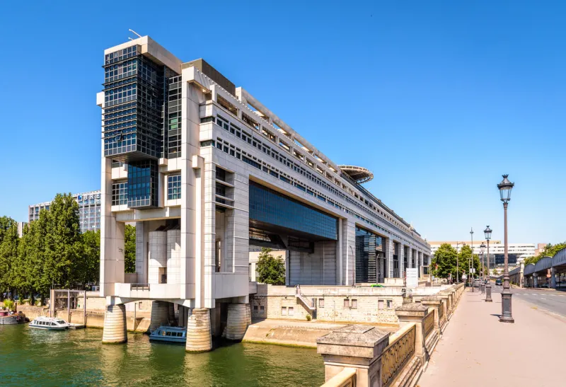 paris, france - june 23, 2020  general view of the colbert building, seat of the ministry of the economy and finance on the banks of the seine river, seen from the bercy bridge