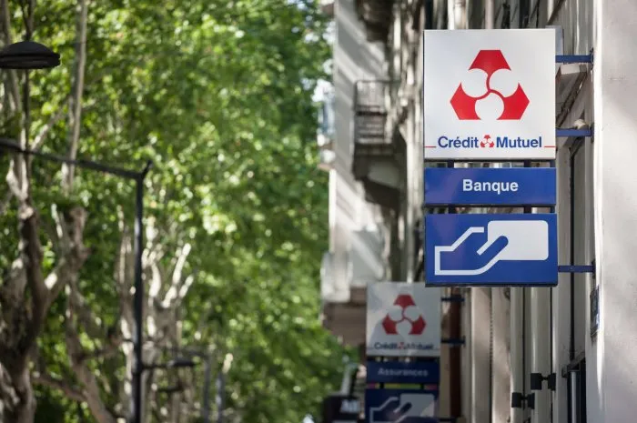 picture of a sign with the logo of credit mutuel on their local banking agency for lyon, france credit mutuel is a french cooperative bank, with headquarters in strasbourg