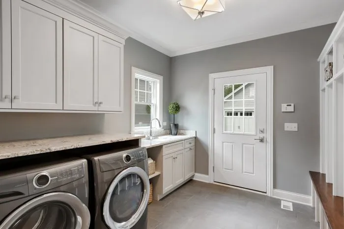 large front loading washer and dryer in newly built home