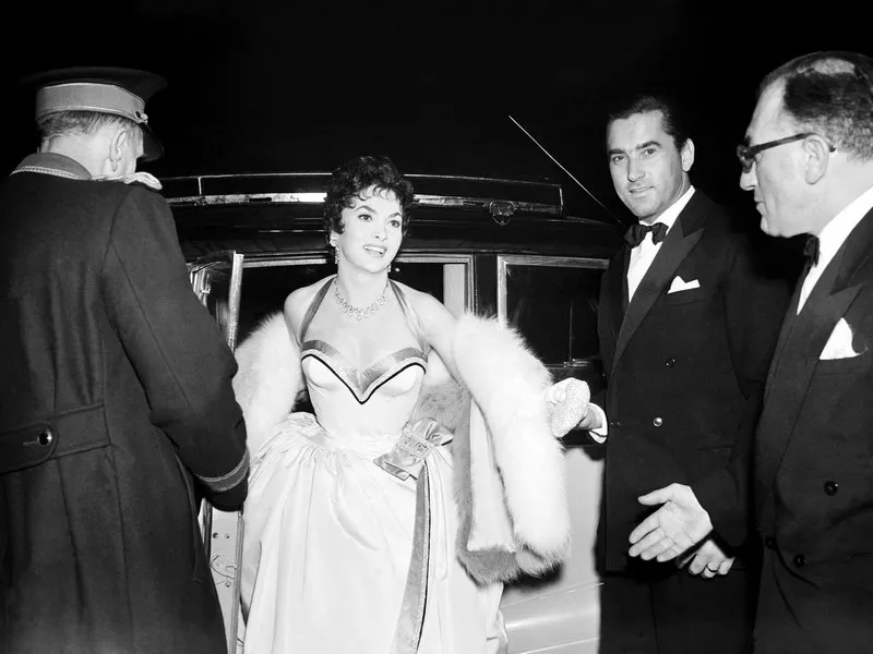 italian actress gina lollobrigida alights from her car at the cinema photo by s&g barratts pa photos abacapresscom