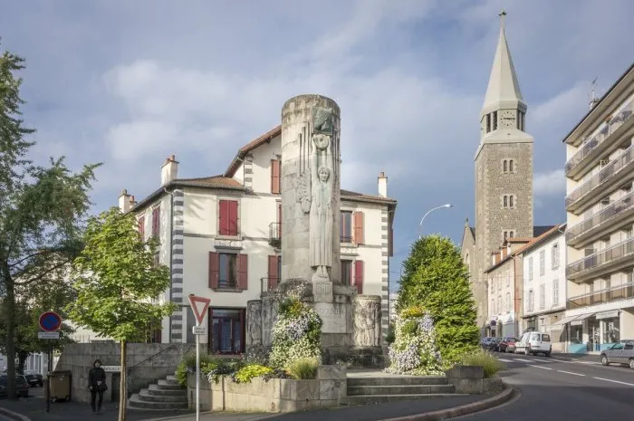 monument of paul doumer and the sacre coeur church in aurillac, france