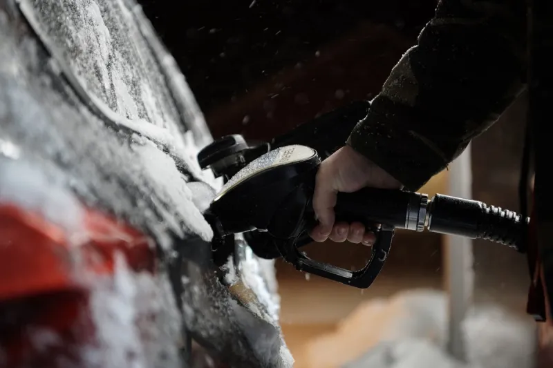 refuelling diesel gas on petrol station on cold winter night