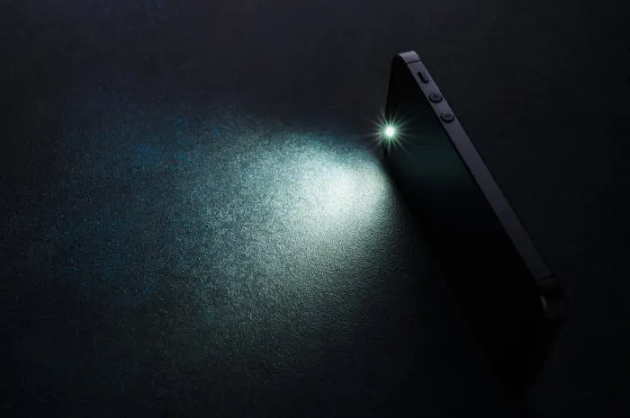 lantern smartphone shines on a dark background