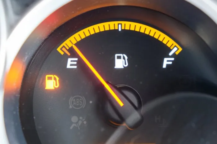 close up low fuel guage shown in a car