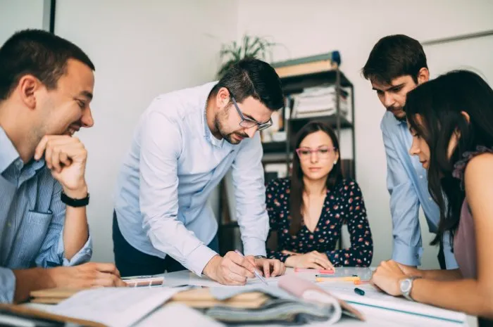 team of young architects working and developing plans in the office