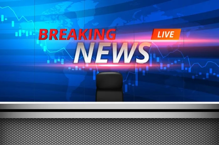 white table and breaking news on lcds background in the news studio room