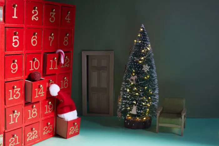 red christmas advent calendar with santa claus hat