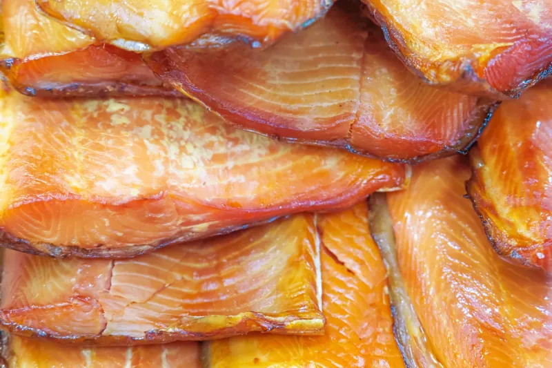 smoked halfs of salmon carcass, hot smoked salmon fillet