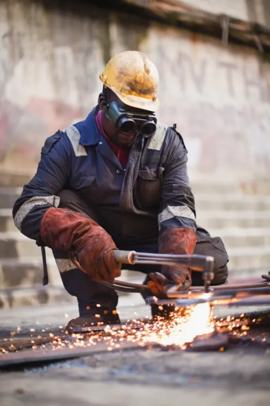 welder at work on dry dock