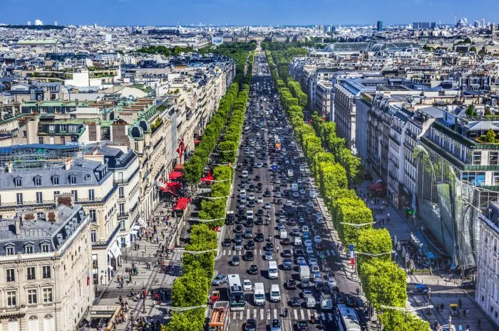 avenue champs elysees shops traffic cafes louvre buildings arc de triomphe view cityscape city center paris france