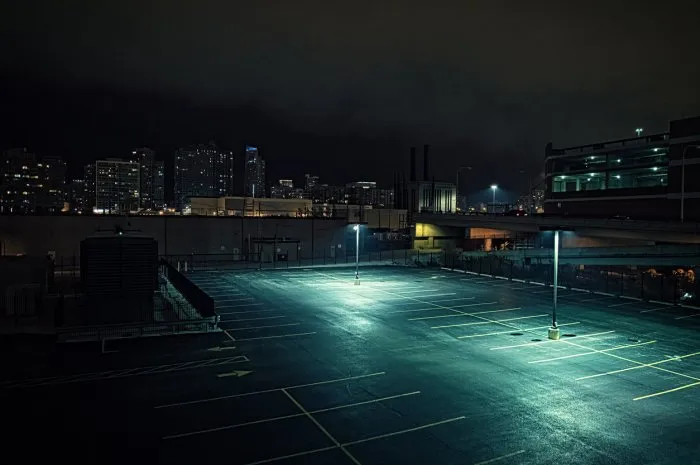big deserted urban city parking lot and garage at night in chicago