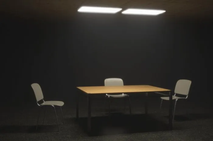 dark interrogation room with chairs and table a disturbing situation