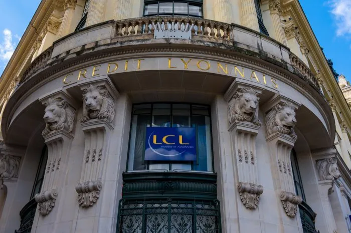 paris, france - july 29, 2021  detail of the facade of the hotel des italiens, former central headquarters of crédit lyonnais (lcl)