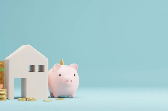 home and piggy bank gold coins with copy space 3d render