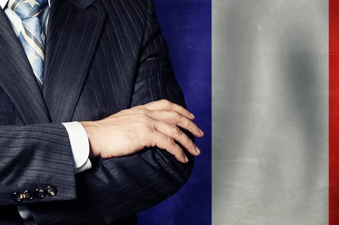 male arms crossed on france flag background