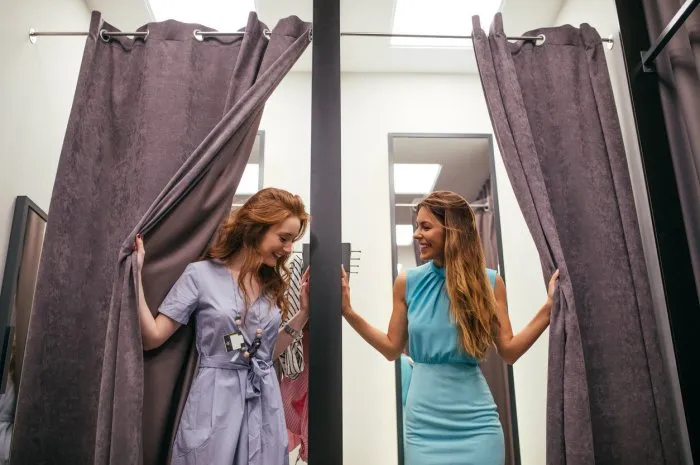 photo of two young women in the fitting room