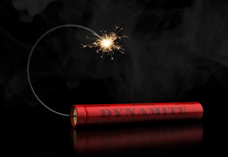 3d render of dynamite stick with burning wick on black background