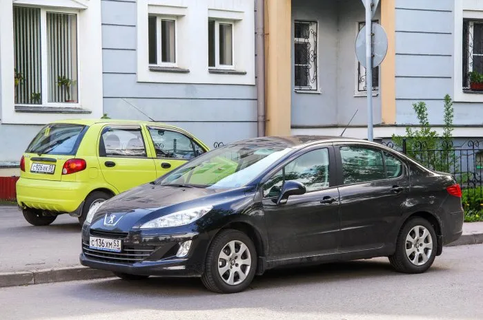 velikiy novgorod, russia - may 23, 2013  black car peugeot 408 in a city street