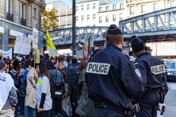 paris, france - october 31, 2015  policemen waiting during the anti racism event marche de la dignité in paris