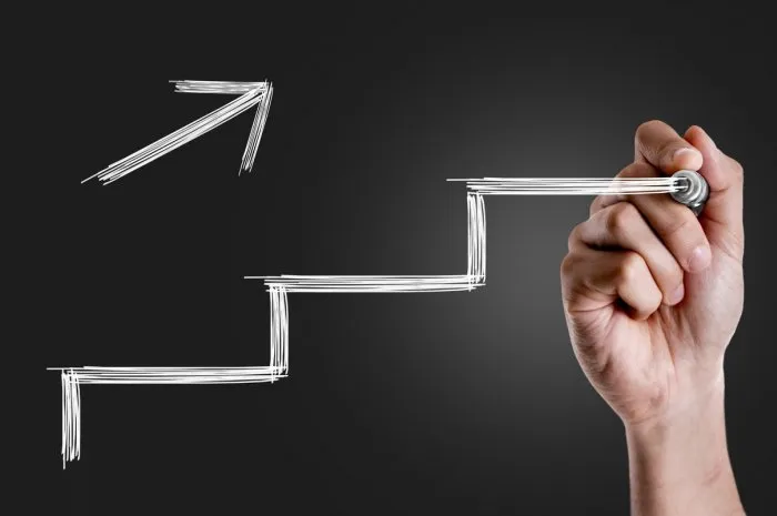 hand drawing a stairs in a conceptual image