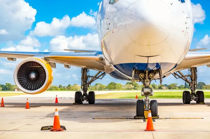 plane close up at the airport with blue sky and clouds aviation or travel concept