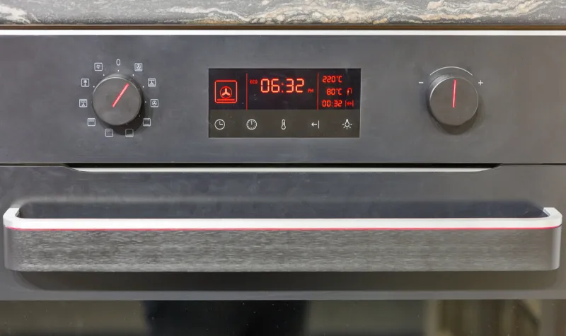 built in electric oven settings panel closeup