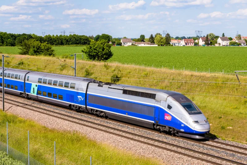 champdeuil, france - june 1, 2022  a tgv duplex high speed train from french rail company sncf is driving from paris on the lgv sud-est in the countryside