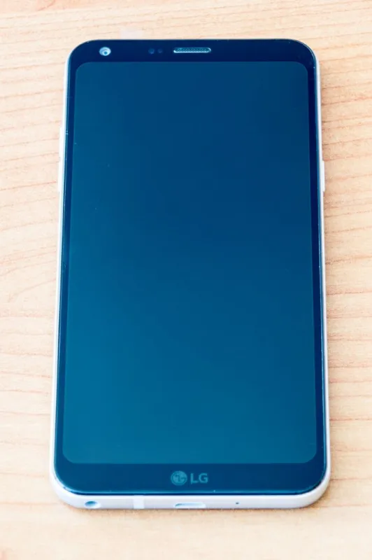 pruszcz gdanski, poland - october 13, 2018  lg q6 mobile phone on wooden table