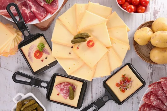 raclette cheese with salami, potato and cheese