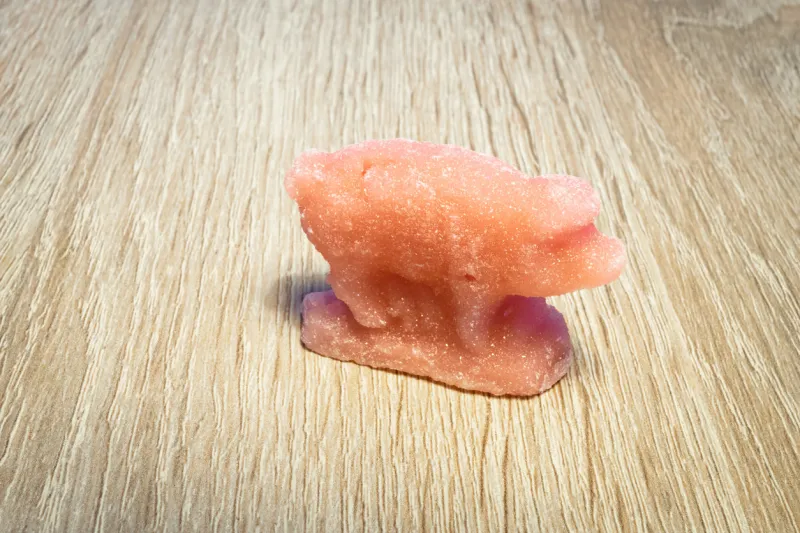 pink colored sugar animal (dutch  suikerbeest) in the form of a pig, a sweet treat given to children during the sinterklaas feast in the netherlands